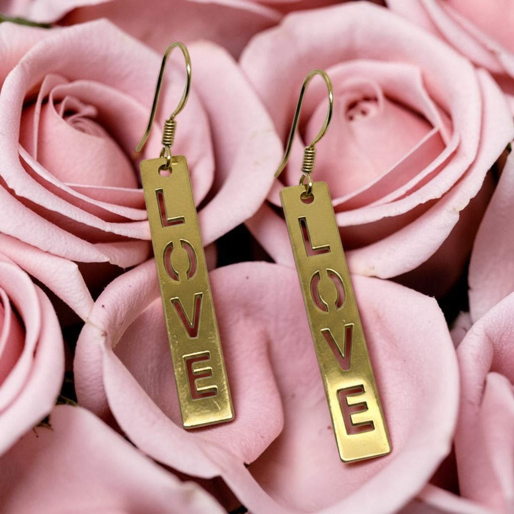 Bedrock Rose gold-plated dangling earrings with laser-cut 'LOVE' text. Surgical steel earwires.