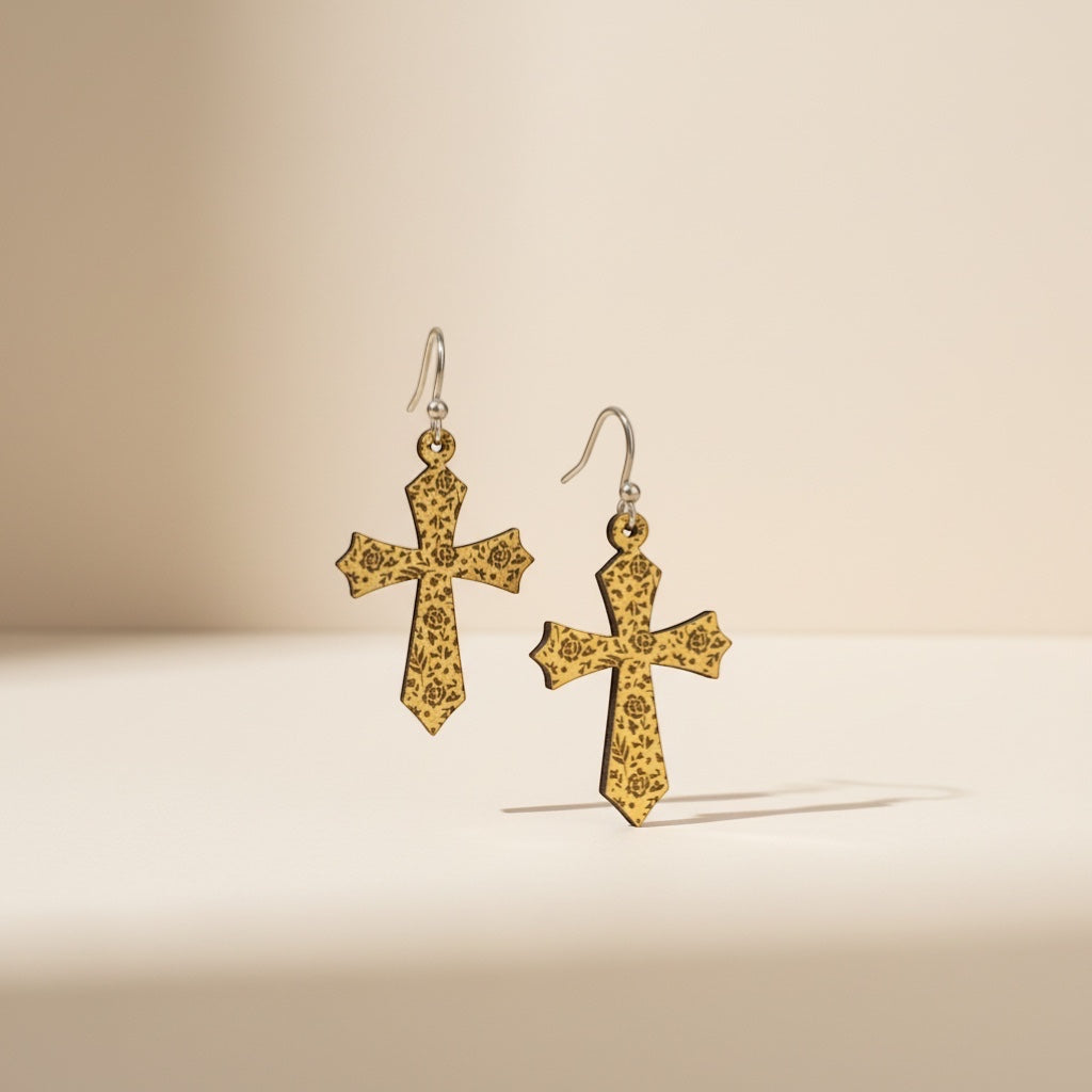Bedrock Rose gold-tone cross earrings with intricate rose etching, dangle style.