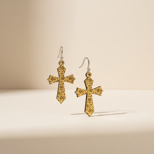 Bedrock Rose gold-tone cross earrings with intricate rose etching, dangle style.