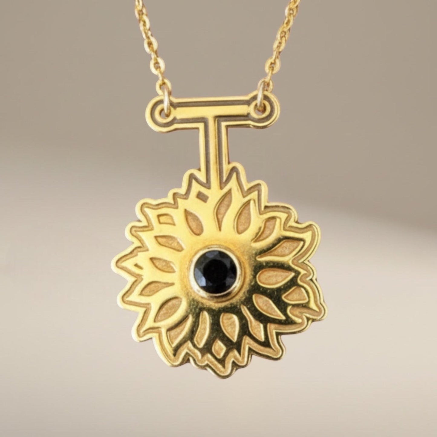 Bedrock Rose gold sunflower pendant necklace with black obsidian center, 24k gold plated brass, 16" chain.