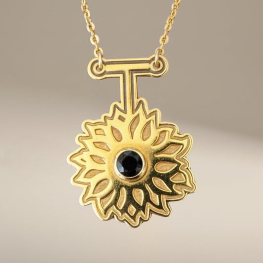 Bedrock Rose gold sunflower pendant necklace with black obsidian center, 24k gold plated brass, 16" chain.