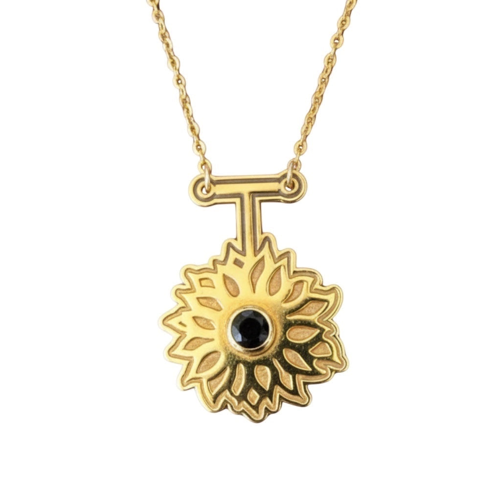Bedrock Rose gold sunflower necklace with black obsidian pendant and gold chain.