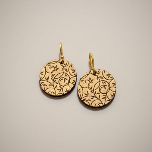 Bedrock Rose gold-tone disc earrings with all-over botanical vine lattice etching. Lightweight dangle style.