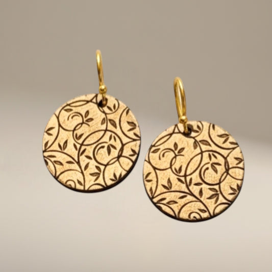 Bedrock Rose gold-tone disc earrings with all-over botanical vine lattice etching. Lightweight dangle style.