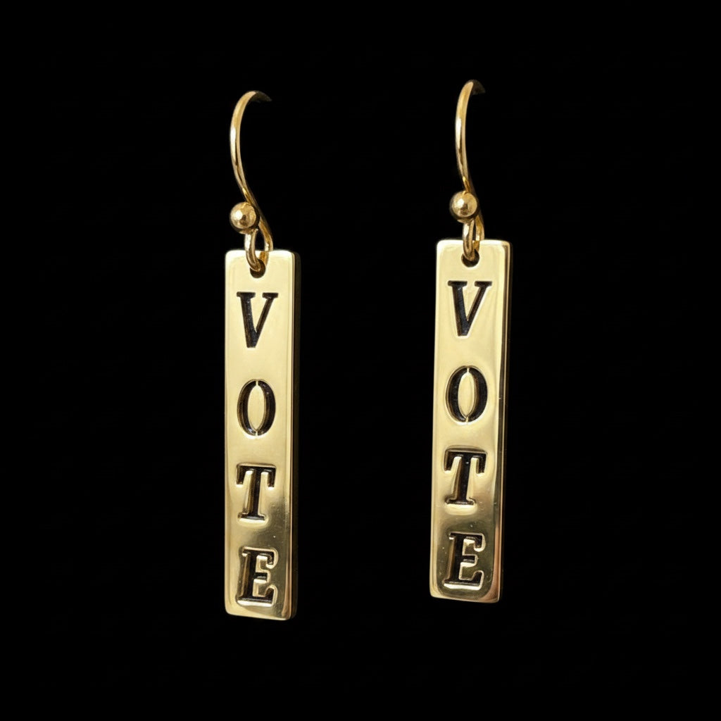 Bedrock Rose gold-plated dangling earrings with laser-cut "Vote" text, perfect for political statements.