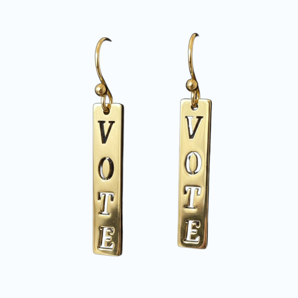 Bedrock Rose gold-plated dangling earrings with laser-cut "Vote" text. A bold statement accessory for any outfit.