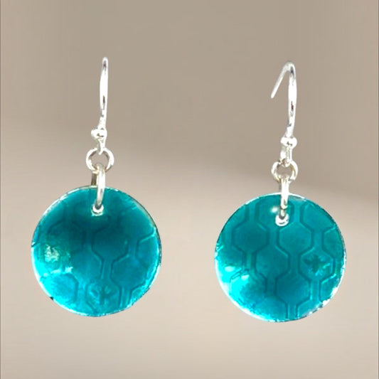Bedrock Rose transparent green circle dangle earrings with honeycomb pattern and silver hooks.