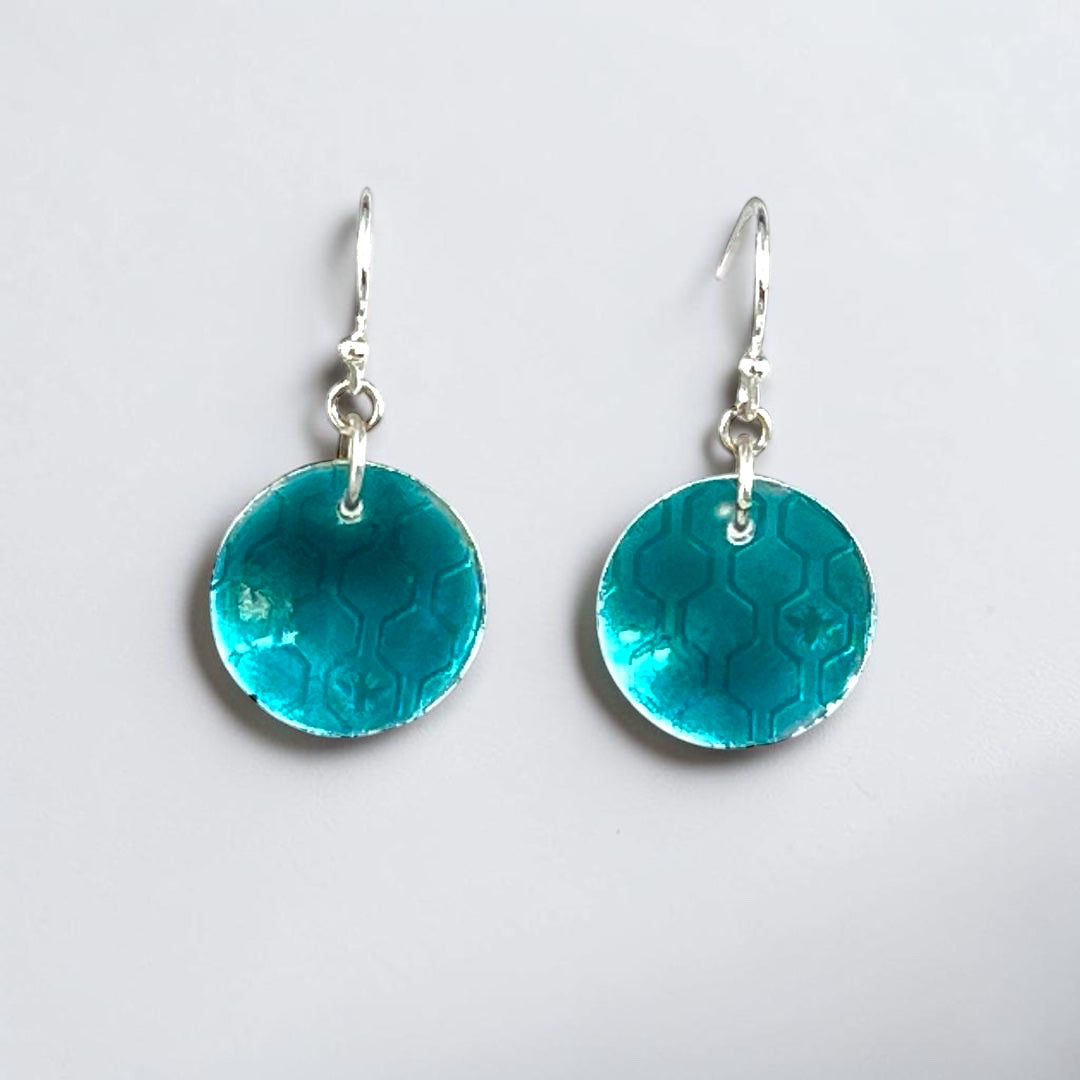 Bedrock Rose transparent green circle earrings with honeycomb pattern and silver hooks.
