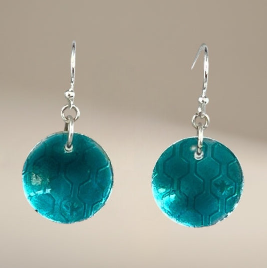 Bedrock Rose transparent green circle dangle earrings with honeycomb pattern and silver hooks.