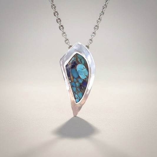 Bedrock Rose sterling silver pendant with Kingman Turquoise, Lapis, and Bronze inlay. Features an 18" hypoallergenic chain.