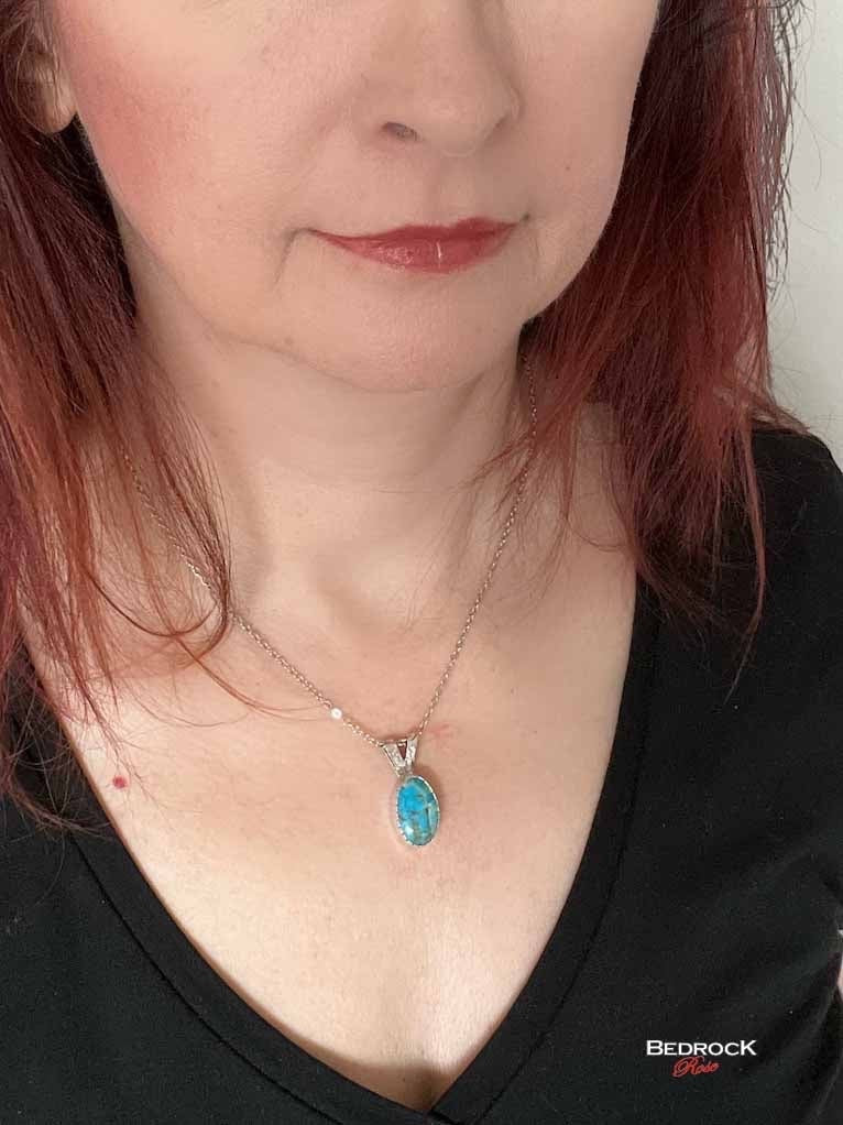Bedrock Rose dainty Kingman turquoise pendant with silver bezel on an 18" chain.