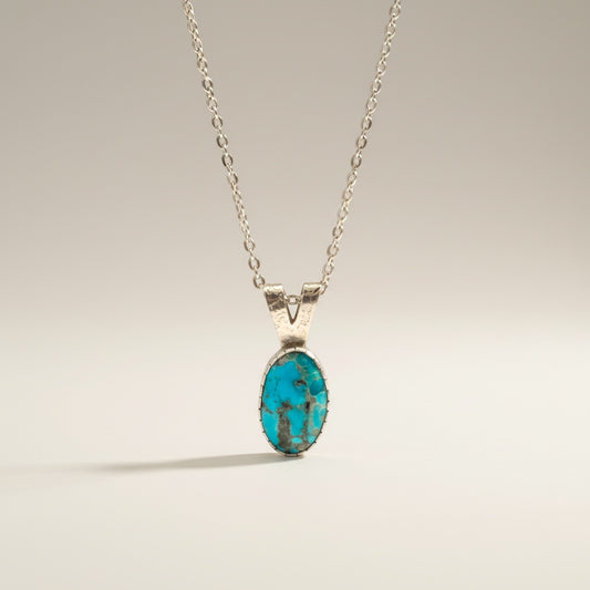 Bedrock Rose Kingman Turquoise pendant with silver bezel on an 18" hypoallergenic chain.