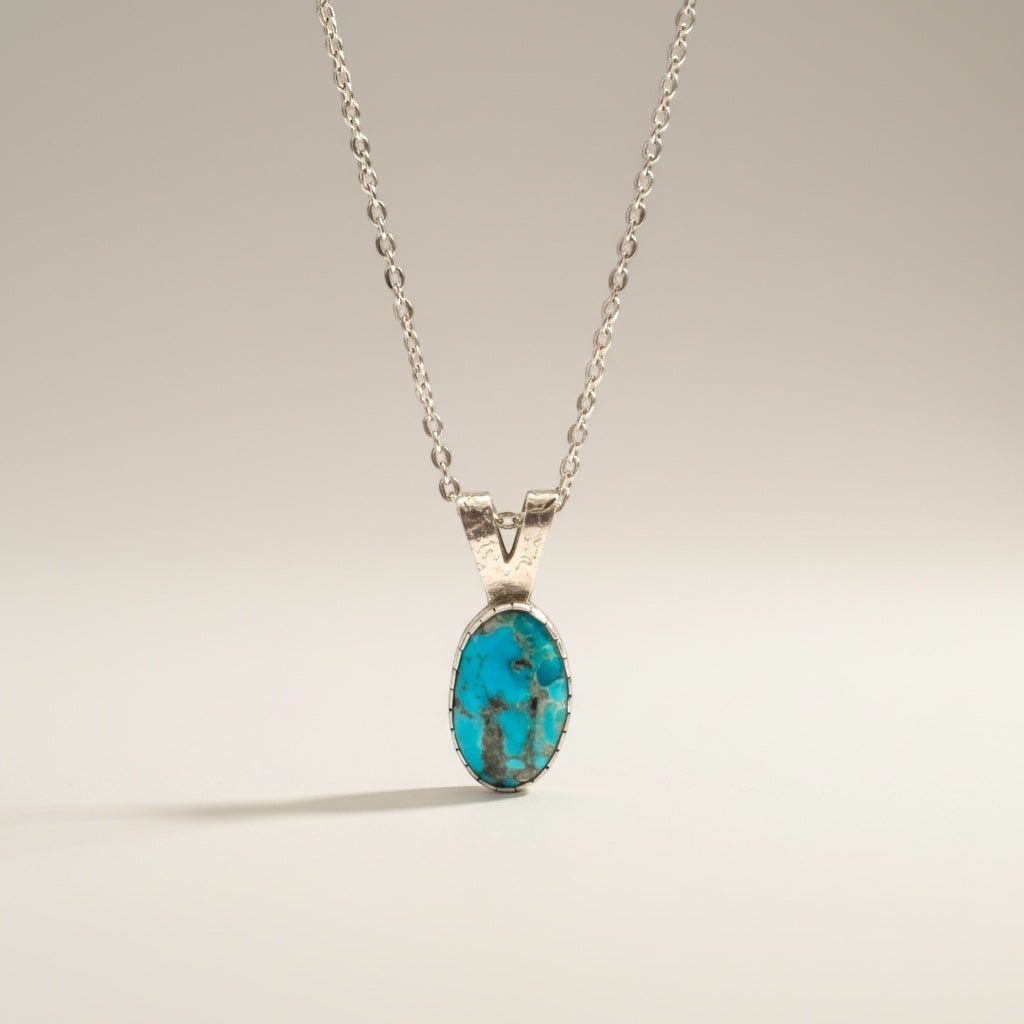Bedrock Rose Kingman Turquoise pendant with silver bezel on an 18" hypoallergenic chain.