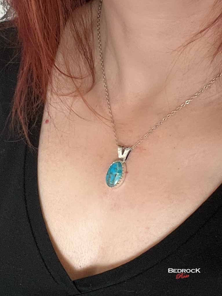 Bedrock Rose dainty Kingman turquoise pendant with silver bezel on an 18-inch chain.