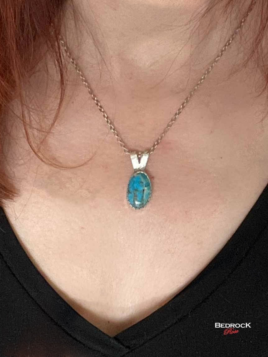 Bedrock Rose dainty Kingman turquoise pendant with silver bezel on an 18-inch chain.