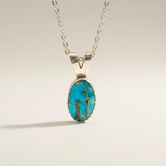 Bedrock Rose Kingman Turquoise pendant with silver bezel and faceted chain, 18 inches.