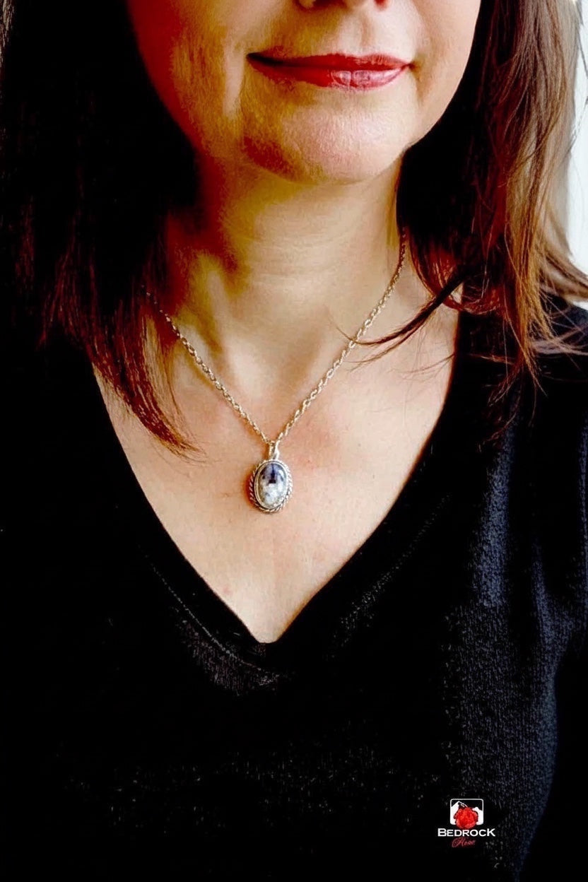 Bedrock Rose elegant Merlinite gemstone pendant with black dendrites in sterling silver with twisted wire and scalloped edge.