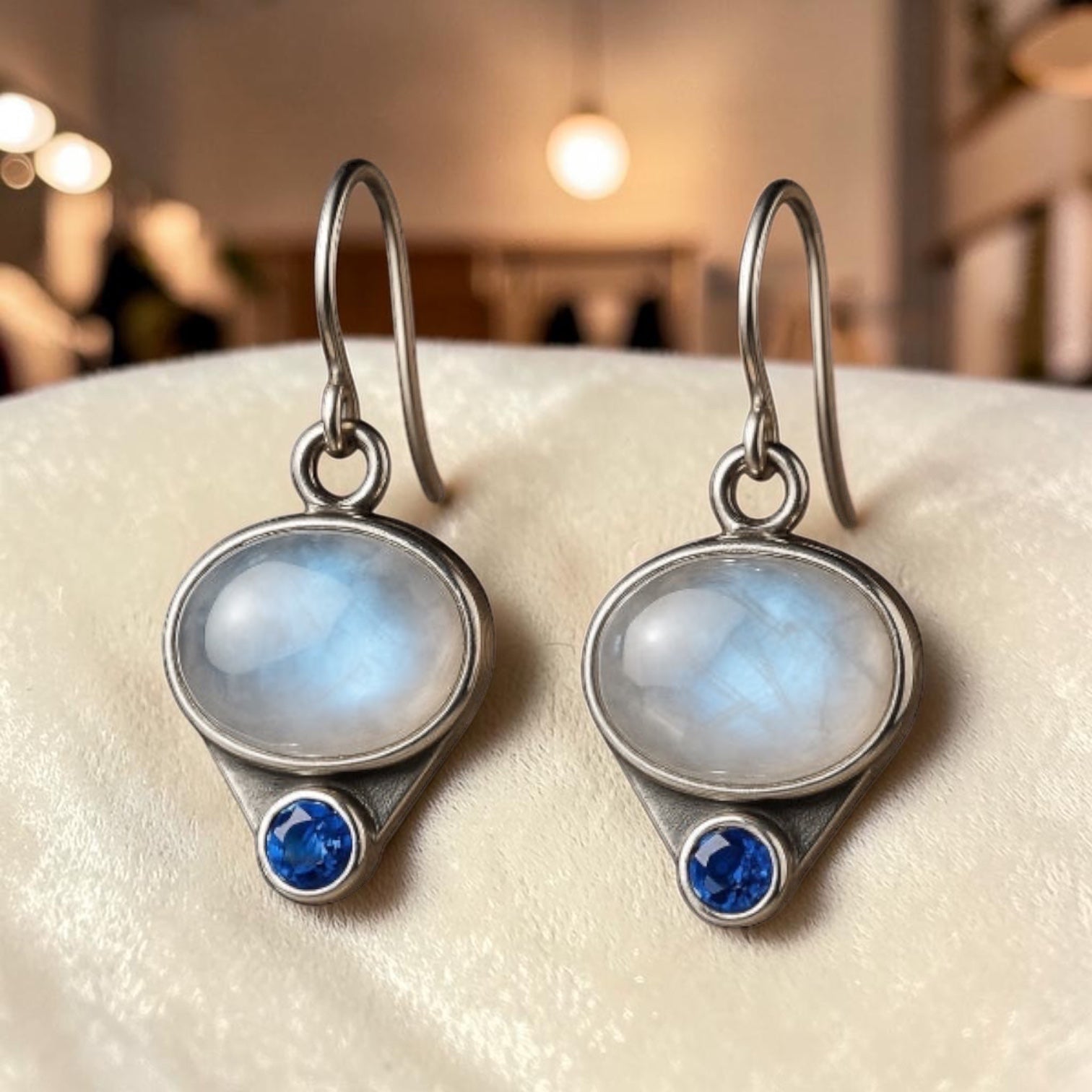 Bedrock Rose oval moonstone and blue sapphire dangle earrings in antiqued silver-tone metal.