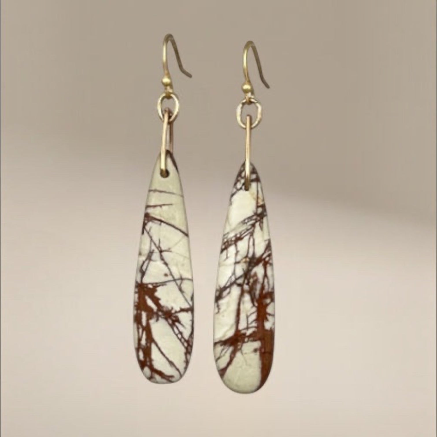 Bedrock Rose Picasso Jasper stone dangling earrings with gold-tone hooks and unique brown veining.