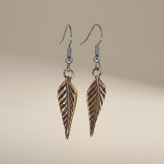 Bedrock Rose dainty rose bronze feather dangling earrings with surgical steel ear wires.