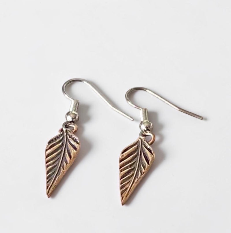 Bedrock Rose dainty rose bronze feather dangling earrings with surgical steel ear wires.
