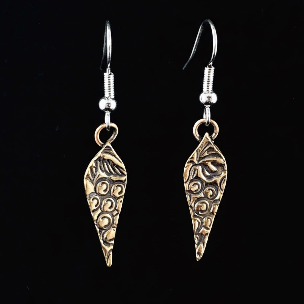 Bedrock Rose Arabesque grapevine dangling earrings in rose-bronze with intricate swirling vine and leaf design.