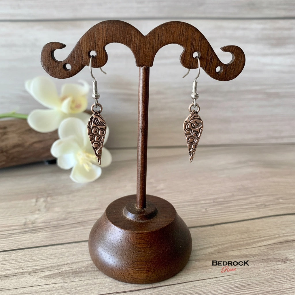 Bedrock Rose Arabesque Grapevine Dangling Earrings in rose-bronze with intricate vine and grape design.