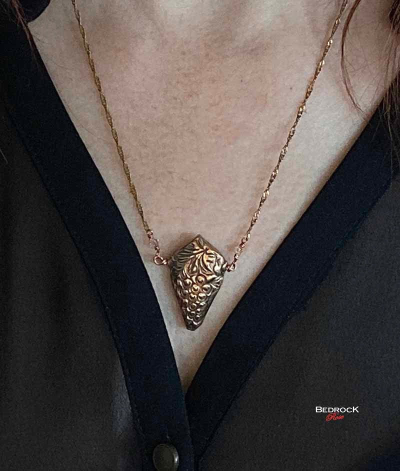 Bedrock Rose 3D grapevine pendant necklace in rose bronze with a 20" brass chain.