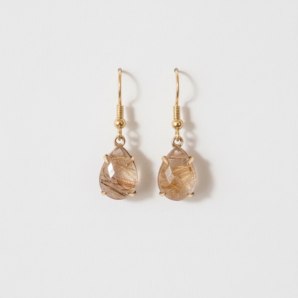 Bedrock Rose prong set pear rutilated quartz drop earrings with gold hooks.