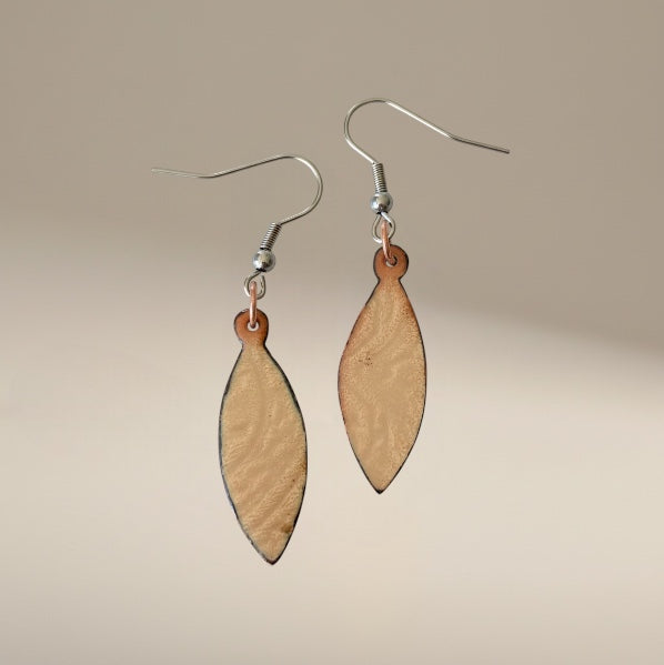 Bedrock Rose shiny copper oval dangling earrings with clear enamel over patterned copper. Quirky and elegant.