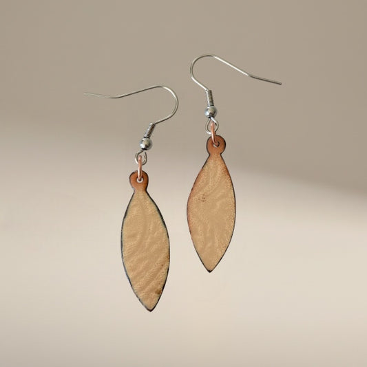 Bedrock Rose shiny copper oval dangling earrings with clear enamel over patterned copper. Quirky and elegant.