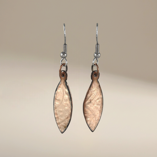 Bedrock Rose shiny copper oval dangling earrings with clear enamel and patterned design.