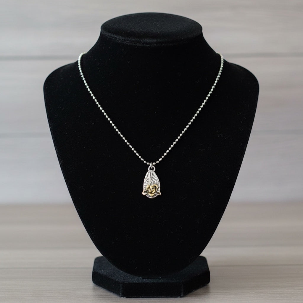 Bedrock Rose silver and gold rose pendant necklace with faceted ball chain.