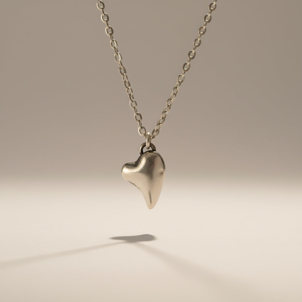 Bedrock Rose fine silver puffed heart pendant on a 16" stainless steel chain. Hypoallergenic and tarnish-free.