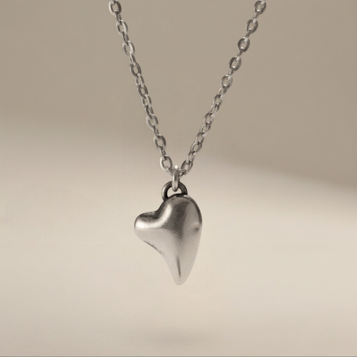 Bedrock Rose fine silver puffed heart pendant on a 16" stainless steel chain. Hypoallergenic and tarnish-free.