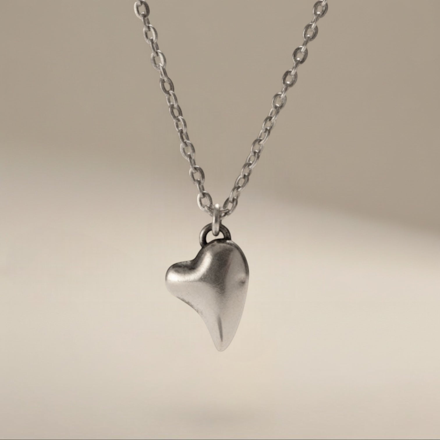 Bedrock Rose fine silver puffed heart pendant on a 16" stainless steel chain. Hypoallergenic and tarnish-free.