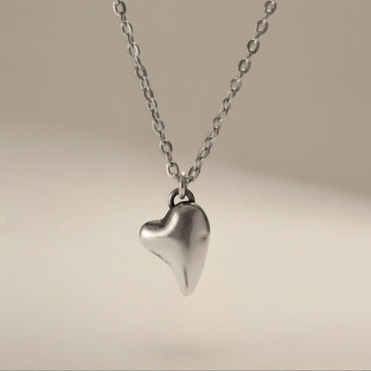Bedrock Rose fine silver puffed heart pendant on a 16" stainless steel chain. Hypoallergenic and tarnish-free.