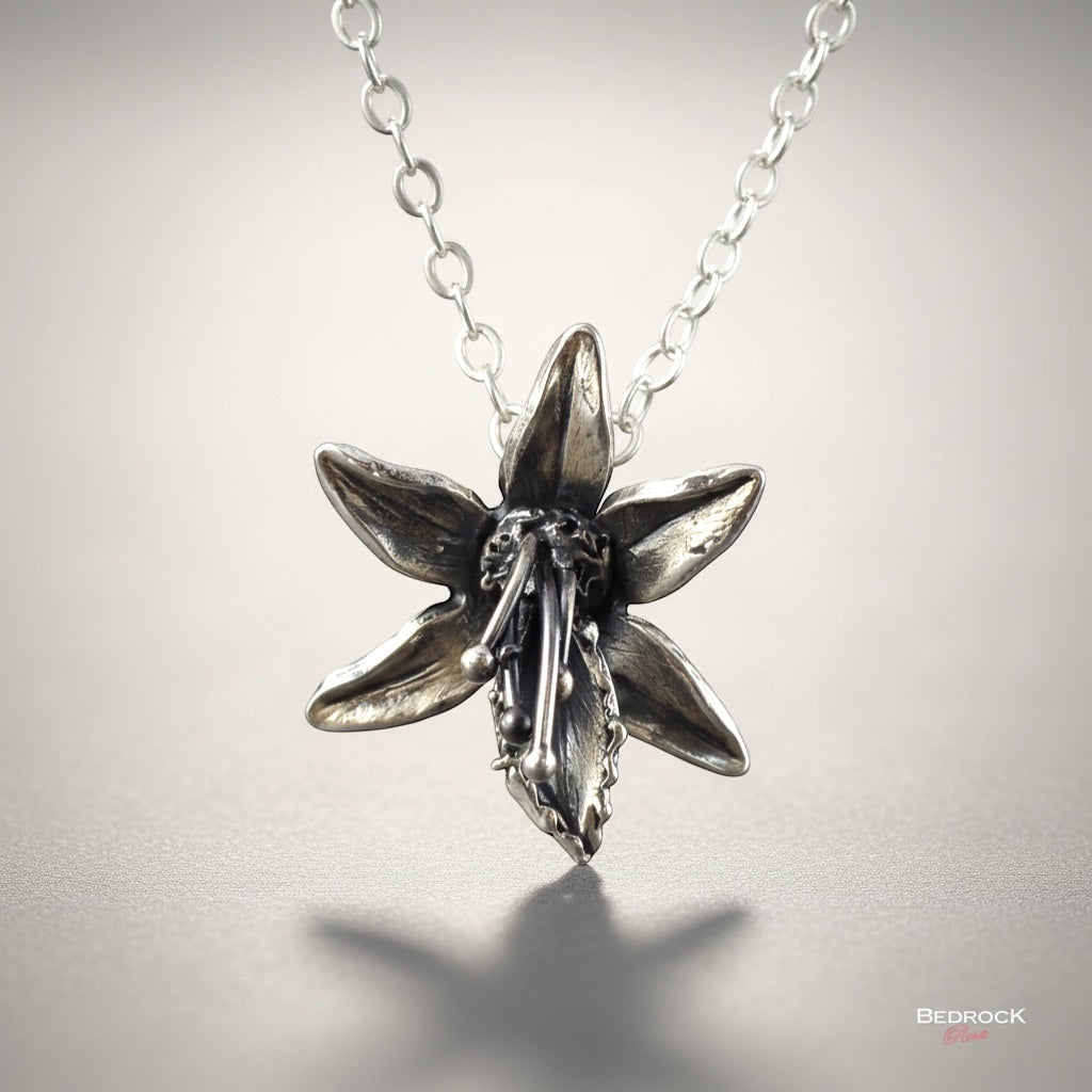 Bedrock Rose fine silver orchid pendant with sterling silver chain. Handcrafted floral statement necklace.