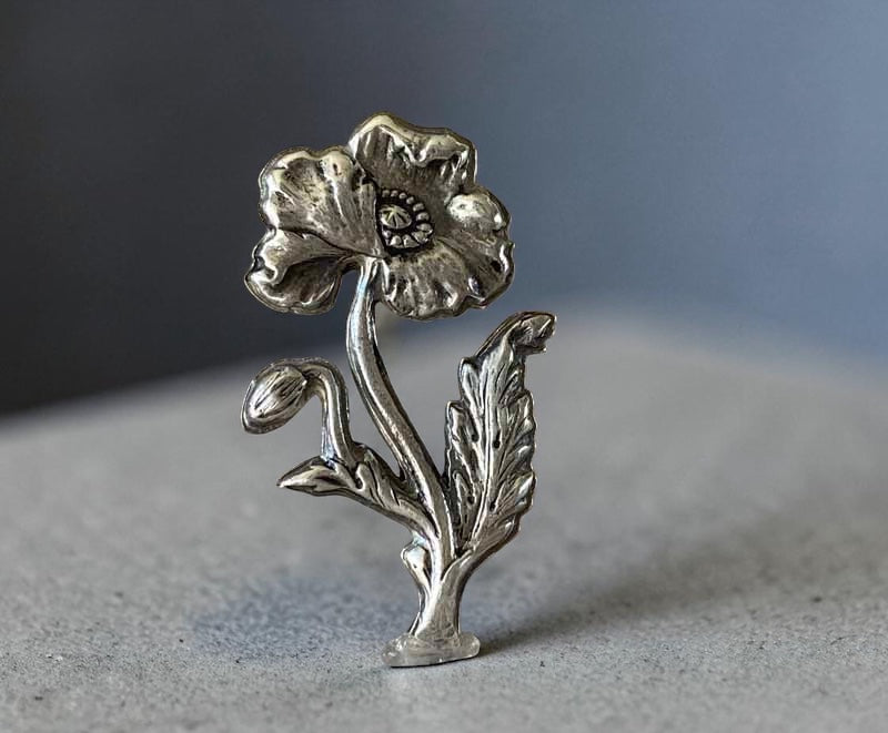 Bedrock Rose Art Nouveau sterling silver poppy brooch with intricate details and a bud.
