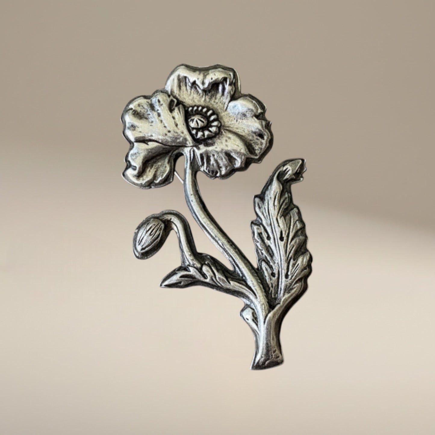 Bedrock Rose Art Nouveau sterling silver poppy brooch with bud and leaf detail.