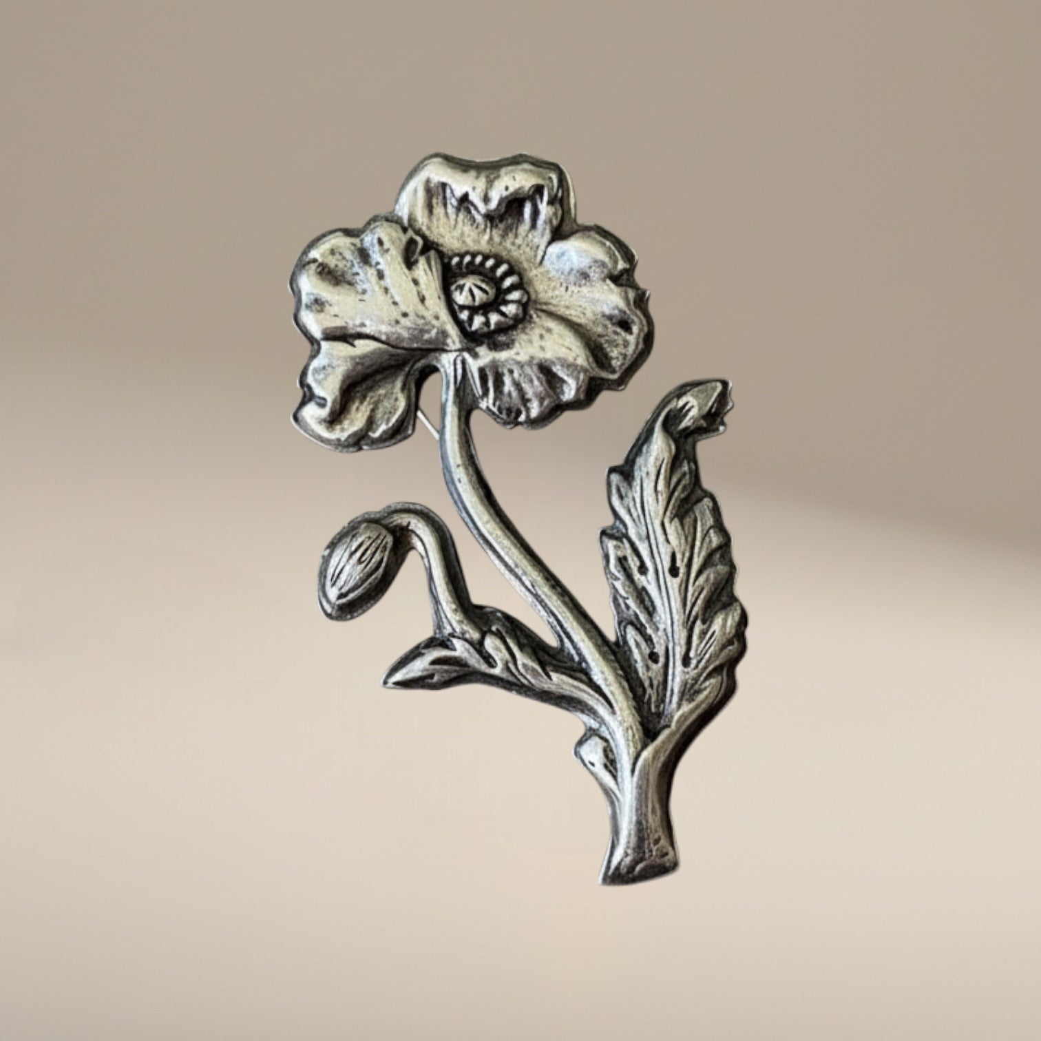 Bedrock Rose Art Nouveau sterling silver poppy brooch with bud and leaf detail.