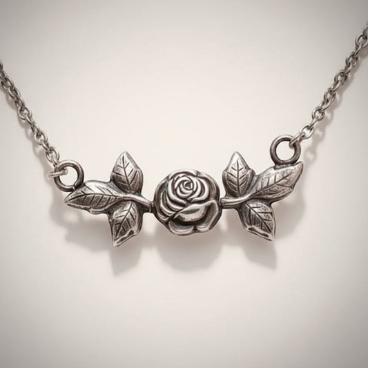 Bedrock Rose silver pendant necklace with a detailed rose and leaf design. Elegant floral jewelry.
