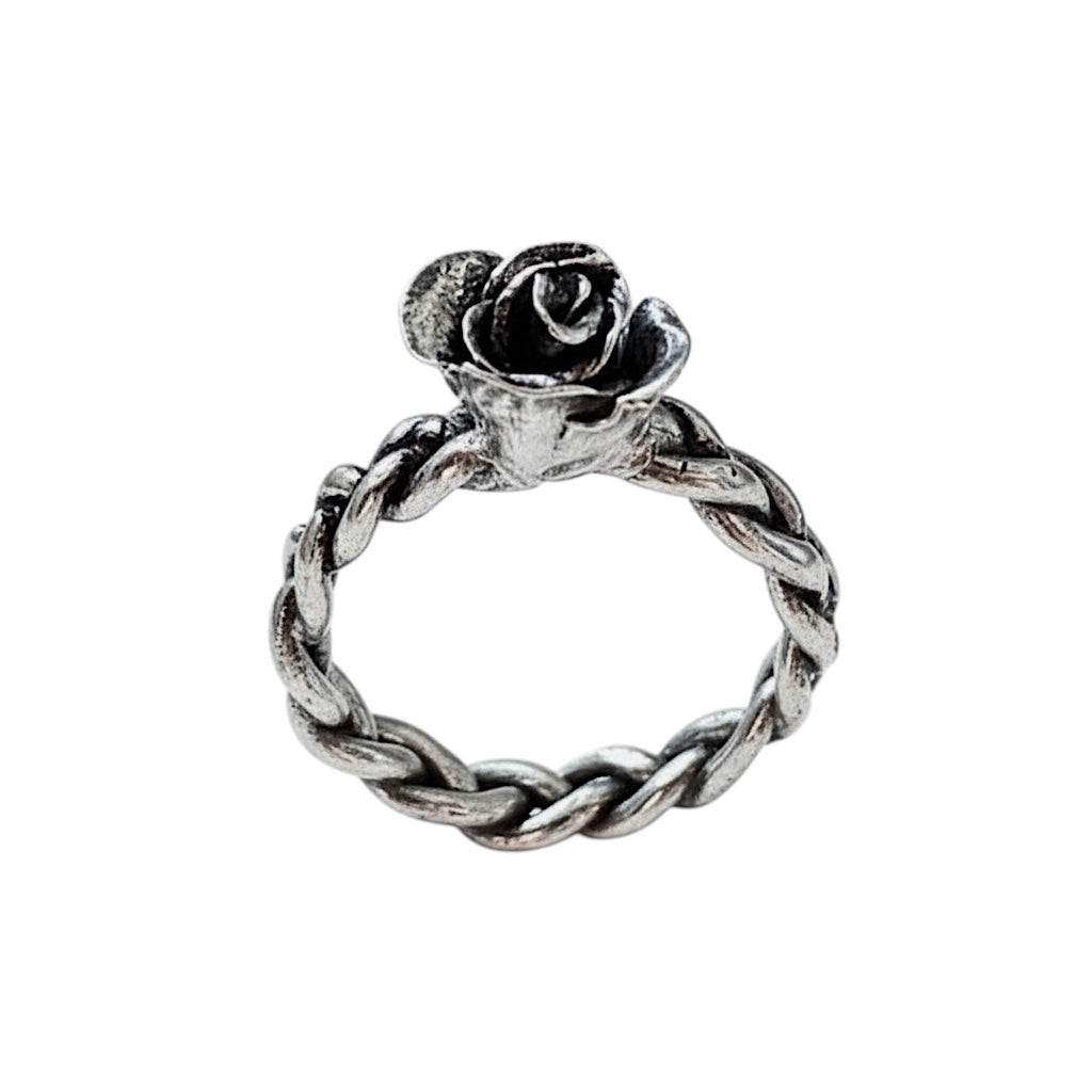 Bedrock Rose hand-sculpted fine silver ring with a rosebud detail on a braided band. Size 8.