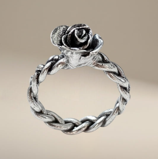 Bedrock Rose hand-sculpted fine silver ring with rosebud detail on braided band, size 8.