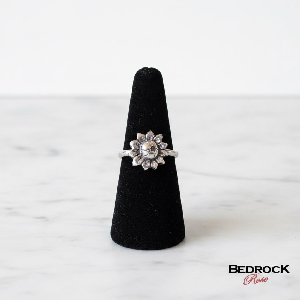 Bedrock Rose sterling silver die-struck sunflower ring with antiqued patina. Botanical statement band.