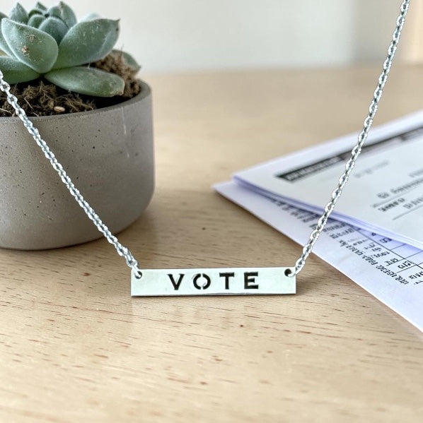 Bedrock Rose silver vote necklace with laser-cut sterling silver pendant and hypoallergenic stainless steel chain.