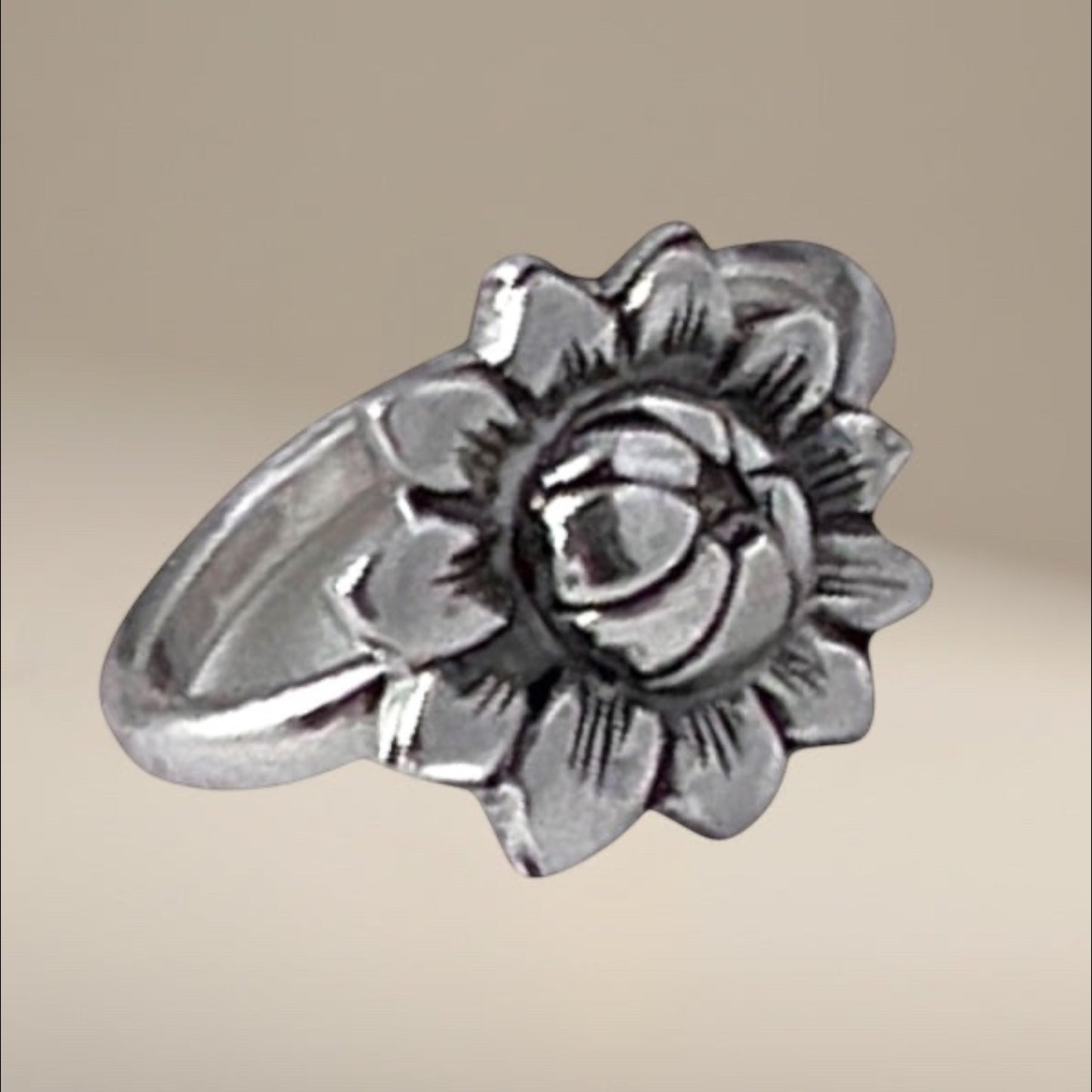 Bedrock Rose sterling silver ring featuring a detailed sunflower design. Adjustable size.