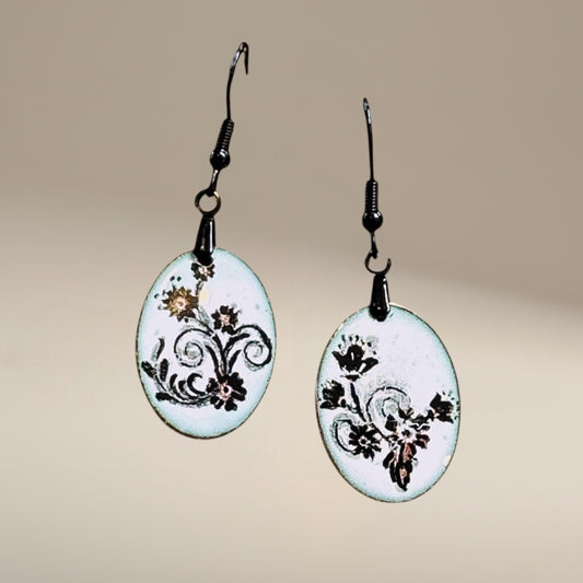 Bedrock Rose petite oval dangle earrings with black floral scroll enamel on white. 12x22mm.