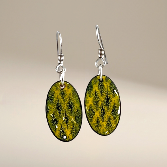 Bedrock Rose yellow and black oval dangling earrings with a textured pattern.