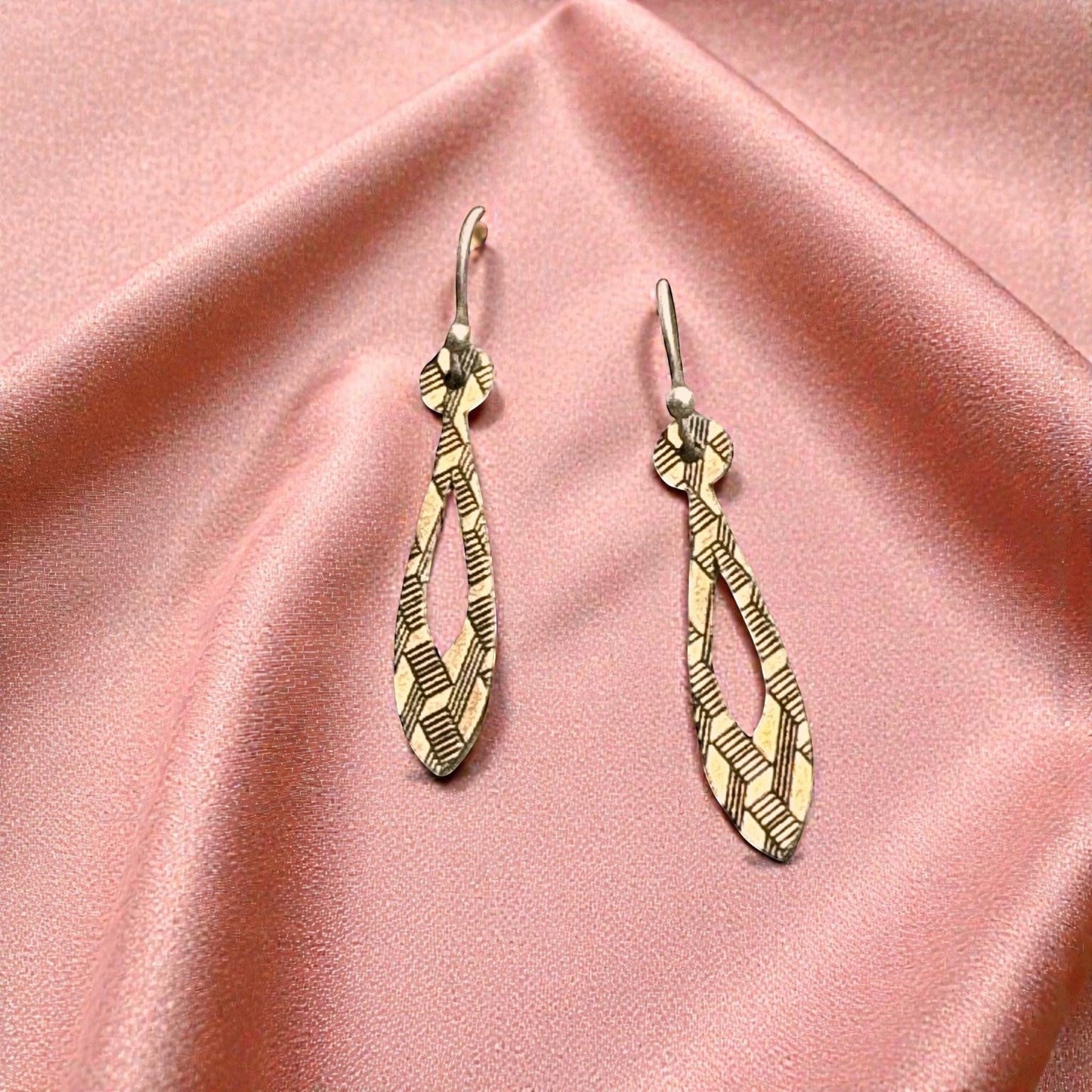 Bedrock Rose gold teardrop dangle earrings with geometric etched pattern. Modern, linear design.